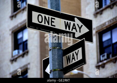 New York City:  Department of Transportation one way street signs on Broadway in Hamilton Heights Stock Photo