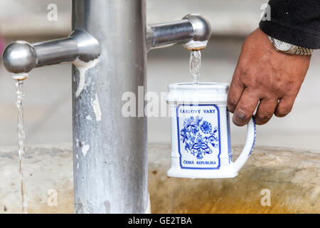 Spa cup for mineral water, Karlovy Vary hot spring, Czech Republic Stock Photo
