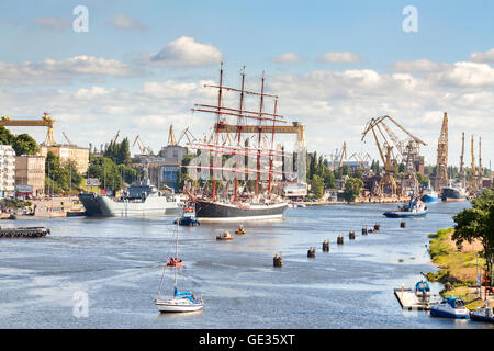 Russian Sedov, one of the biggest participating sailing ships is about to leave the harbor. Stock Photo