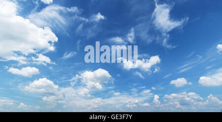 White heap clouds in the blue sky at the summer day. Stock Photo