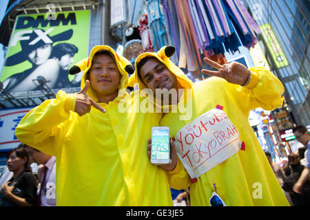 Fans try out Pokemon Go in Tokyo's Shibuya district on July 22, 2016, Tokyo, Japan. The Pokemon Go app finally arrived in the land of the Pokemon on Friday 22, July two weeks after its launch in the United States. The release of the app in Japan had been rumoured for the past few days after the leak of details of a partnership deal with McDonald's Japan to create Pokemon Gyms in its 3,000 locations. Nintendo's market value has almost doubled since the app created by Niantic first launched in America. © Rodrigo Reyes Marin/AFLO/Alamy Live News Stock Photo