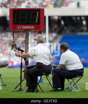 Queen Elizabeth Park, London, UK. 23rd July, 2016. London Anniversary Athletics. The track official marks the last lap of the Womens 5000metre Steeplechase with the bell ringing. Credit:  Action Plus Sports/Alamy Live News Stock Photo