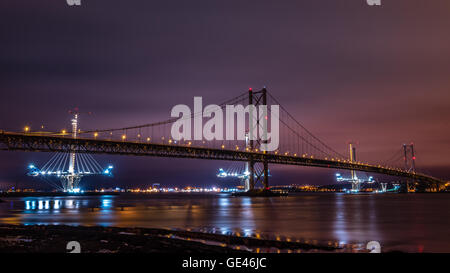 The old and new Forth Road bridges from Queensferry at night Stock Photo
