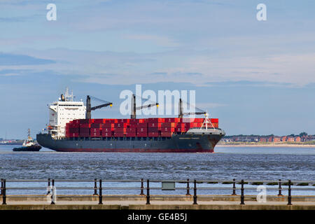 The ship INDEPENDENT PURSUIT,  a Container ship registered in Liberia arriving in the River Mersey en-route to Seaforth Container port, UK. Stock Photo