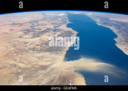 Description This astronaut photograph provides a panoramic view of most of the length of the Red Sea. The northernmost end, the Gulf of Suez, is just visible at the top center of the image and is fully 1,900 kilometers (1,200 miles) in ground distance from the International Space Station (ISS). The Nile River snakes its way northward through the Sahara Desert on the left. Much closer to the camera—but still more than 550 kilometers (340 miles) from the ISS—is a dust plume surging out over the Red Sea and reaching most of the way to Saudi Arabia. The point source of this plume is the delta of t Stock Photo