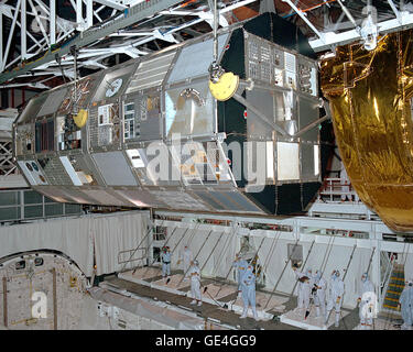 Suspended above the payload bay of the Space Shuttle Columbia, the Long Duration Exposure Facility (LDEF) is monitored by technicians during its move from the Space Shuttle to a transportation canister. LDEF, with 57 experiments was launched on STS-41C on April 6, 1984.  It spent almost six years in space before being retrieved by the STS-32 crew in January 1990.  Image #: 90PC-0098 Date: January 30, 1990 Stock Photo