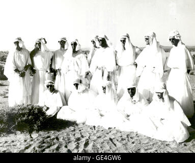 (August 1964) Fourteen NASA astronauts pose for group pictures at Stead Air Force Base in Nevada after a three-day stay in the Nevada desert where they completed a course in desert survival training. Front row: (left to right) William Anders, Walter Cunningham, Roger Chaffee, Richard Gordon, and Michael Collins. Second row: (left to right) Clifton Williams, Eugene Cernan, David Scott, Donn Eisele, Russell Schweickart, Edwin Aldrin, Alan Bean, Charles Bassett and Theodore Freeman. Stock Photo