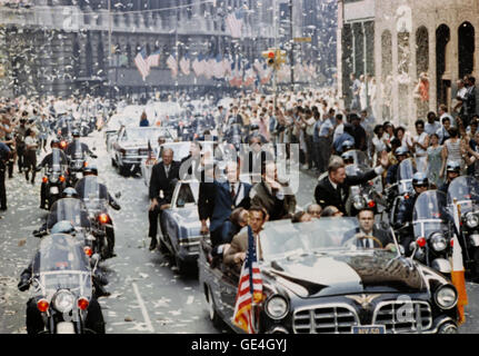 New York City welcomes Apollo 11 crewmen in a showering of ticker tape down Broadway and Park Avenue in a parade termed as the largest in the city's history. Pictured in the lead car, from the right, are astronauts Neil A. Armstrong, commander; Michael Collins, command module pilot; and Edwin E. Aldrin Jr., lunar module pilot. The three astronauts teamed for the first manned lunar landing, on July 20, 1969.   Photo Number: S70-17433 Date: August 13, 1969 Stock Photo