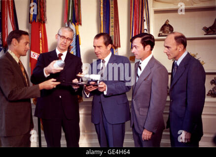 A model of the Apollo-Soyuz spacecraft with docking adapter is shown to President Richard Nixon. The NASA Apollo 16 astronauts, John W. Young, Charles M. Duke, Thomas K. Mattingly, with NASA Administrator Dr. James C. Fletcher met with President Richard Nixon at the White House for a progress report on the Joint U.S. and U.S.S.R. Space Docking Project. The Apollo-Soyuz Test Project launched three years later on July 15, 1975.                                                                                                                   Image #: 72-HC-522  Date: June 15, 1972 Stock Photo