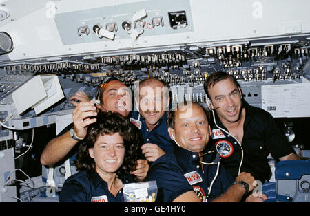 Space Shuttle Challenger's STS-7 crew poses for a group portrait on the forward flight deck. Left to right are Mission Specialist Sally Ride, Commander Robert Crippen, Pilot Frederick Hauck, Mission Specialist Norman Thagard and Mission Specialist John Fabian. Sally Ride was the first American woman to fly in space and NASA's youngest astronaut at the time.   Image # : s07-30-1574 Date: June 21, 1983 Stock Photo