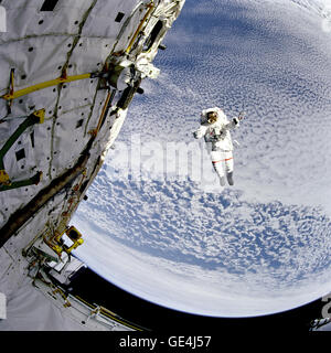 (September 16, 1994) Backdropped against the blue and white Earth 130 nautical miles below, astronaut Mark C. Lee tests the new Simplified Aid for EVA Rescue (SAFER) system.  Image # : STS064-217-008 Stock Photo
