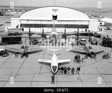The fleet of NACA test aircraft are assembled in front of the hangar at the High Speed Flight Station, (later renamed the Dryden Flight Research Center) in Edwards, California. The white aircraft in the foreground is a Douglas Aircraft D-558-2 Skyrocket. To its left and right are North American F-86 Sabre chase aircraft. Directly behind the D-558-2 is the P2B-1 Superfortress, (the Navy version of the Air Force B-29). Also known as the &quot;mothership,&quot; the P2B-1 carried aloft the D-558-2 Skyrocket under its fuselage. Once reaching altitude, the D-558-2 was released from the &quot;mothers Stock Photo