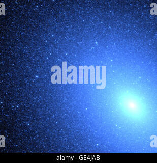 (October 26, 1999) Hubble Space Telescope's exquisite resolution has allowed astronomers to resolve, for the first time, hot blue stars deep inside an elliptical galaxy. The swarm of nearly 8,000 blue stars resembles a blizzard of snowflakes near the core (lower right) of the neighboring galaxy M32, located 2.5 million light-years away in the constellation Andromeda. Hubble confirms that the ultraviolet light comes from a population of extremely hot helium-burning stars at a late stage in their lives. Unlike the Sun, which burns hydrogen into helium, these old stars exhausted their central hyd Stock Photo