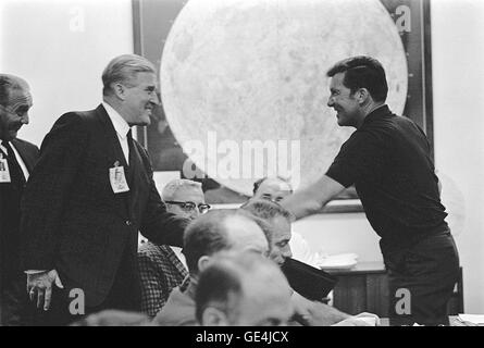 (October 10, 1968) Apollo 7 Commander Walter M. Schirra, Jr., left, greets Dr. Wernher Von Braun, Director, Marshall Space Flight Center and Dr. Kurt Debus, Right, KSC Director, during a prelaunch mission briefing held at the Florida Spaceport.  Image # : 68P-0405