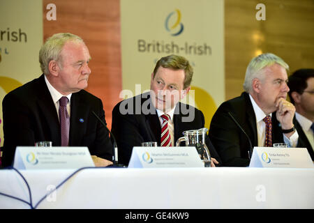Irish Taoiseach Enda Kenny, centre, speaks beside Northern Ireland Deputy First Minister Martin McGuinness, left, and Wales First Minister Carwyn Jones, during a press conference following an emergency meeting of the British Irish Council in Cardiff, at the Temple of Peace, Cardiff. Stock Photo