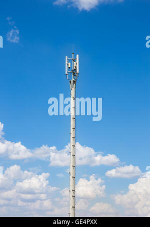 Communication antenna repeater tower on blue sky background Stock Photo