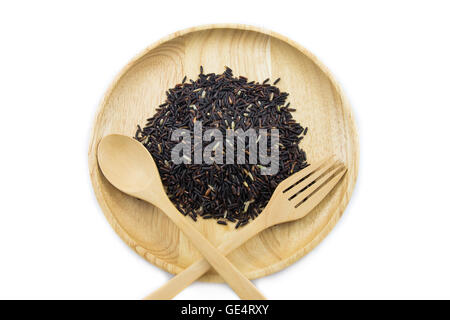Rice berry in wooden bowls with spoon and fork on white background. concept Stock Photo