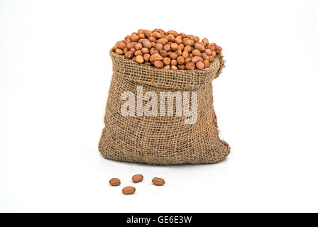 Bag Full of Peanuts on White Background Stock Photo