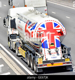 Cemex logistics bulk cement powder transport via articulated tanker lorry on UK motorway with Union Flag graphics Essex England UK Stock Photo