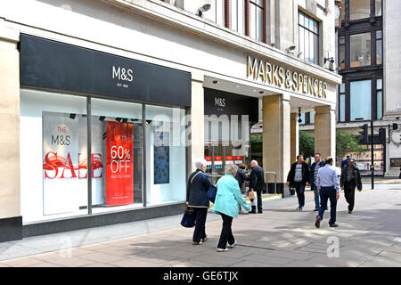 Oxford Street shopping mecca with shop front windows and wide pavement of Marks and Spencer London West End flagship M&S store in London England UK Stock Photo