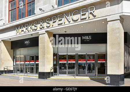 Entrance to Marks and Spencer flagship store early morning view gap in pedestrians walking along Oxford Street London West End England UK Stock Photo