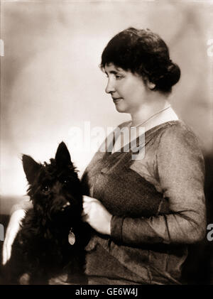 Helen Keller (1880-1968) American deaf and blind author and with her Scottish terrier named Darkie. See description for more information.