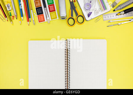 student workplace with notebook and other school and office stationary Stock Photo