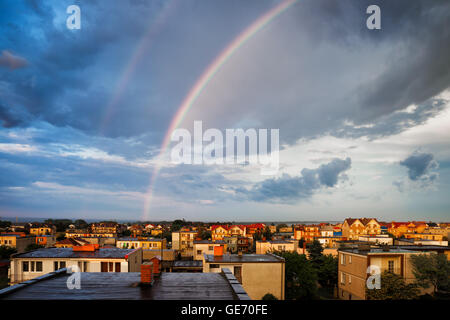 Rainbow above Wladyslawowo town in Poland at sunset, resort coastal town at the Baltic Sea, Pomerania region. Stock Photo