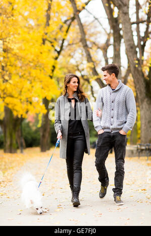 Loving couple walking in the autumn park Stock Photo