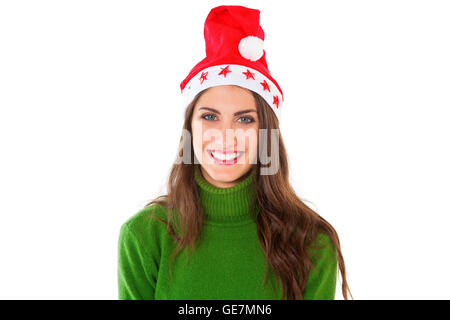 A photo of attractive young woman wearing Santa hat. happy female is in green turtleneck sweater. She is standing isolated on wh Stock Photo