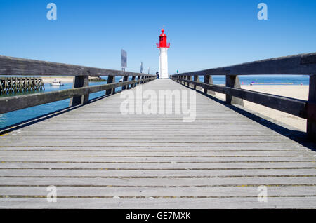 Sun parched jetty leading up to the Trouville lighthouse in Normandy, France Stock Photo