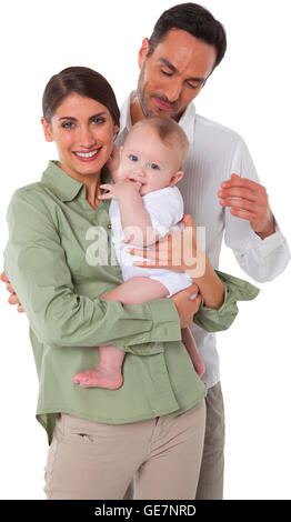 Portrait of happy mother and father with baby Family of three are spending quality time together They are in casuals isolated Stock Photo