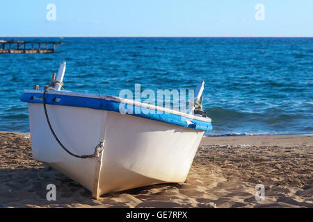 Old Rowing boat on a sandy beach Stock Photo - Alamy
