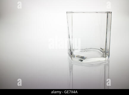 Crystal empty glass to whiskey. On a white background. Stock Photo