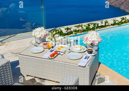 Breakfast for the newlyweds on the shore of the sea Stock Photo