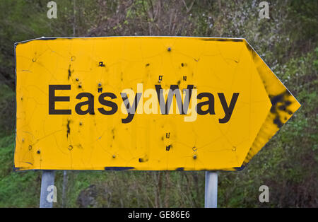 Text Easy Way written on a yellow road sign Stock Photo