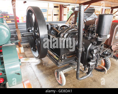 This old stationary engine is displayed in the Museum for Nostalgia and Technique, located at Dorpsstraat 38, Langenboom. The engine represents a piece of industrial history, showcasing early mechanical technology used in various applications, including agriculture and manufacturing. The museum preserves these technological artifacts as part of its extensive collection. Stock Photo