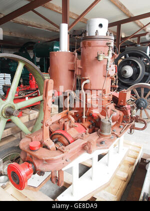 This image features an antique stationary engine displayed in the Museum for Nostalgia and Technology in Langenboom, Netherlands. The motor is part of the museum’s collection, showcasing the history of technological advancements and industrial machinery. Stock Photo