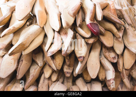 Shoe lasts in cobbler's workshop Stock Photo