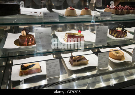 A cake display of hand-coated cakes on sale at a high-class cafe/ restaurant, Gerbeaud  was founded by a Swiss family in the ear Stock Photo