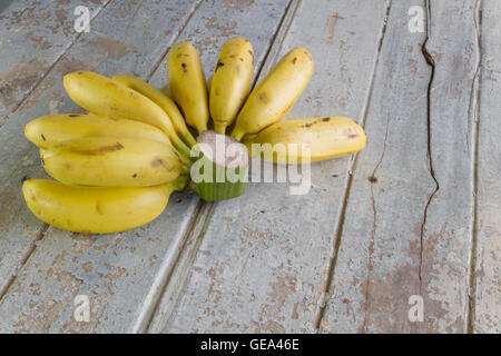 Bunch of ripe bananas on the wooden background Stock Photo