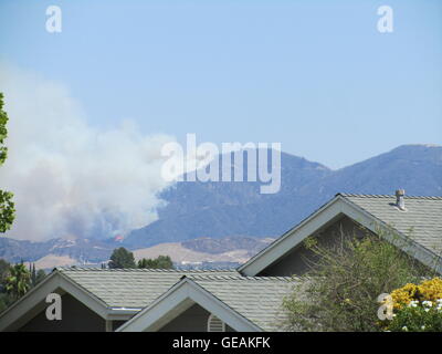 Los Angeles, USA.  24th July, 2016. The Sand Fire burns in the San Gabriel Mountains, south of Santa Clarita, mandatory evacuations, homes burned, the 14-freeway closed, 1 casualty, as over a thousand firefighters battle this fire that started on July 22, 2016 at 2:14pm, high temperatures and winds hamper firefighters efforts to protect homes and businesses.  Santa Clarita, CA, USA.  Credit:  Kenneth White/Alamy Live News. Stock Photo