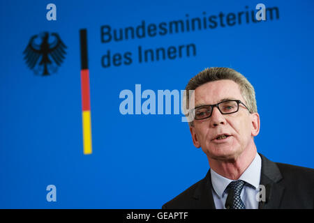 Berlin, Germany. 25th July, 2016. German Interior Minister Thomas de Maiziere addresses a press conference in Berlin, Germany, July 25, 2016. Thomas de Maiziere said Monday a terrorism link to the suicide attack in Ansbach could not be ruled out. Credit:  Zhang Fan/Xinhua/Alamy Live News Stock Photo