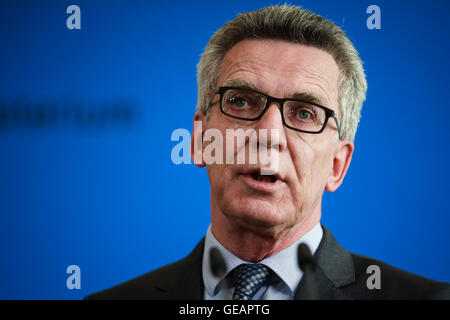 Berlin, Germany. 25th July, 2016. German Interior Minister Thomas de Maiziere addresses a press conference in Berlin, Germany, July 25, 2016. Thomas de Maiziere said Monday a terrorism link to the suicide attack in Ansbach could not be ruled out. Credit:  Zhang Fan/Xinhua/Alamy Live News Stock Photo