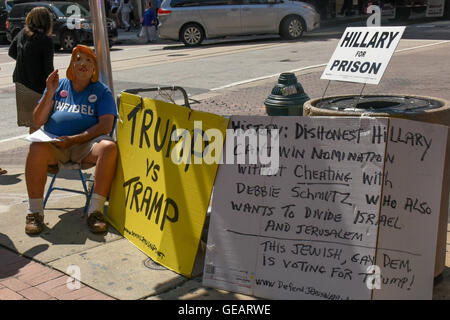 Philadelphia, USA. 25th July, 2016. Democratic National Convention in Philadelphia.  A man with a Hillary Clinton mask protests her candidacy outside of the Philadelphia Convention Center Credit:  Don Mennig/Alamy Live News Stock Photo