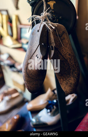 Shoe lasts in cobbler's workshop Stock Photo