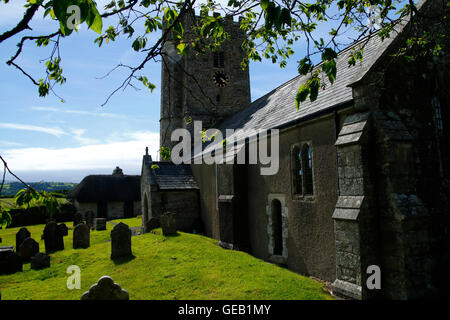 Saxon church at Buckland-in-the-moor with the famous clock face 'My Dear Mother' commissioned by the Whiteley family in memory Stock Photo