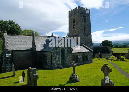 Saxon church at Buckland-in-the-moor with the famous clock face 'My Dear Mother' commissioned by the Whiteley family in memory Stock Photo