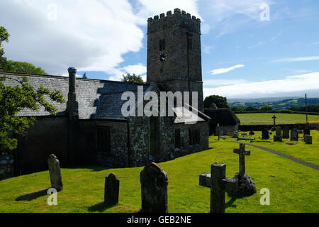 Saxon church at Buckland-in-the-moor with the famous clock face 'My Dear Mother' commissioned by the Whiteley family in memory Stock Photo