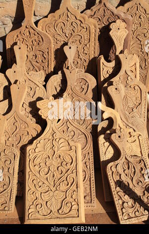 Example of traditional Uzbek woodcarving displayed in a carver's workshop. Stock Photo